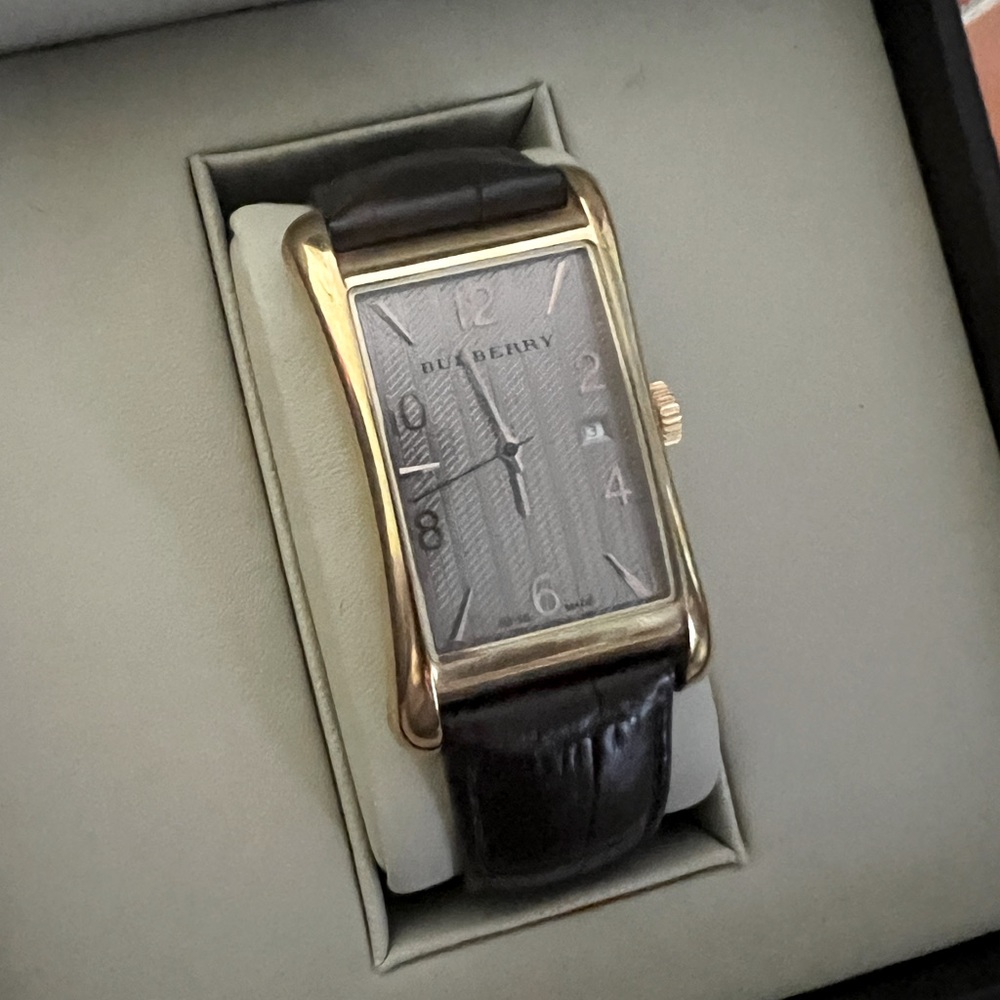 Men’s gold Burberry watch